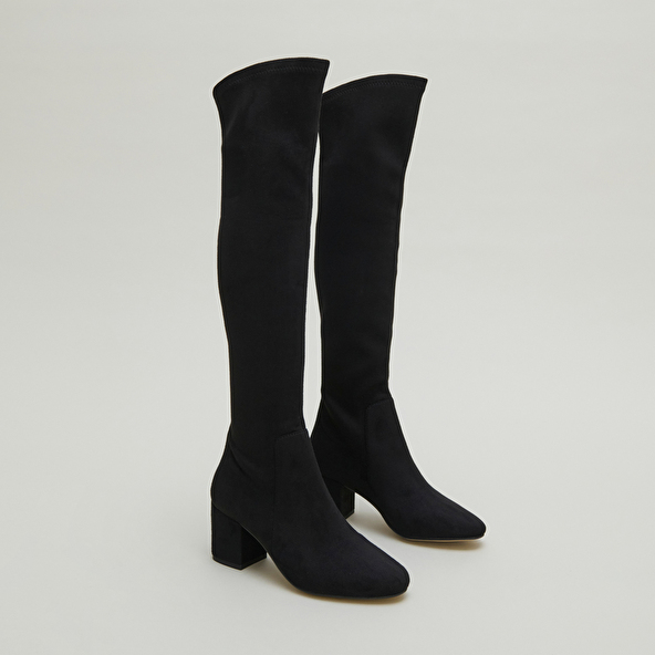 Thigh-high boots with low heels in black stretch and velvet | MIA