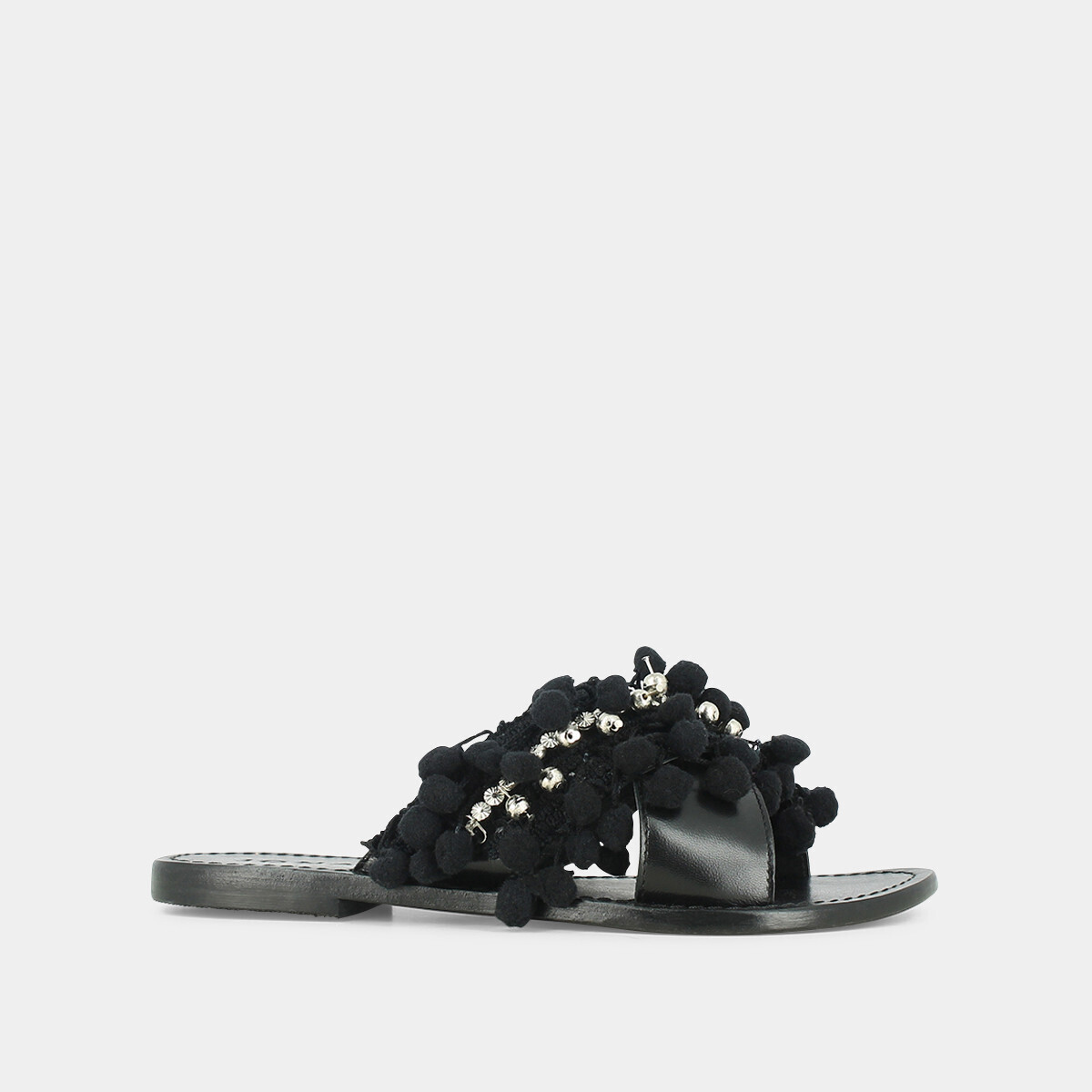 Mules in black leather and textile with pompoms and beads | JACK