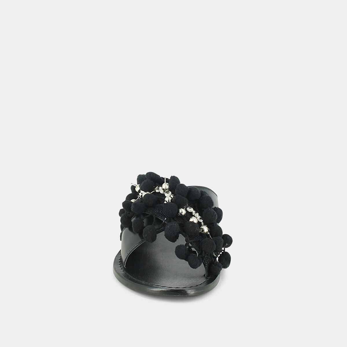 Mules in black leather and textile with pompoms and beads | JACK