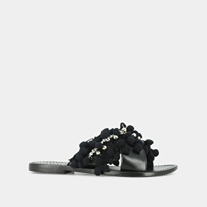 Mules in black leather and textile with pompoms and beads | jack