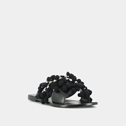 Mules in black leather and textile with pompoms and beads | jack