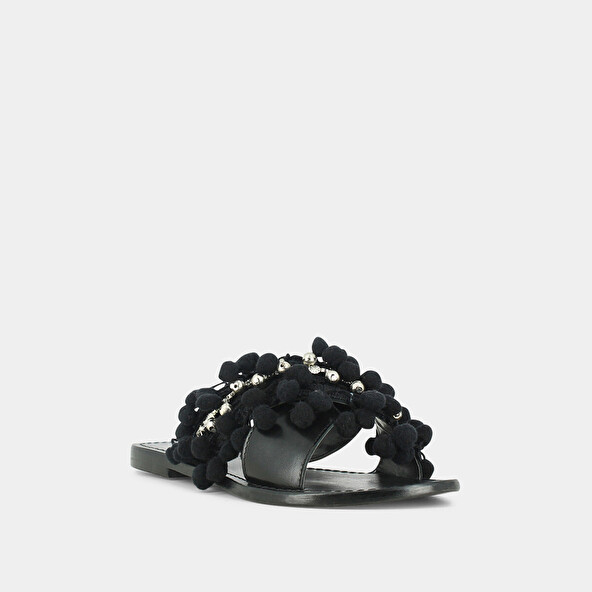 Mules in black leather and textile with pompoms and beads | JACK