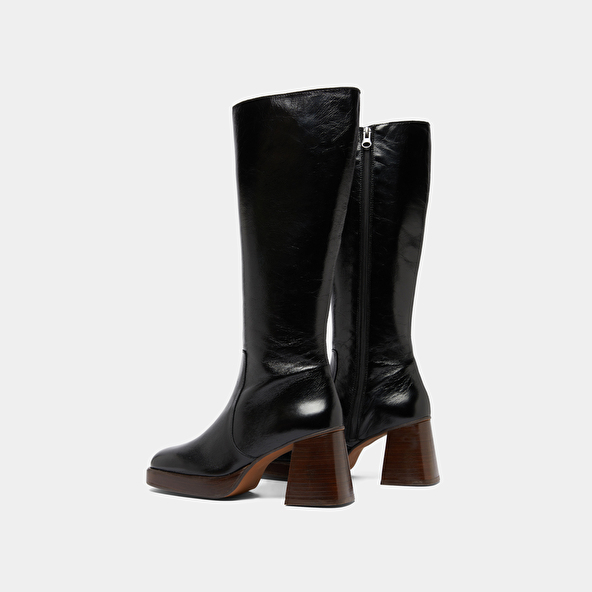 Platform boots in distressed black leather | BETINA