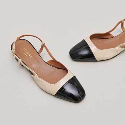 Open back ballet flats in black and beige patent leather | DHAPOU