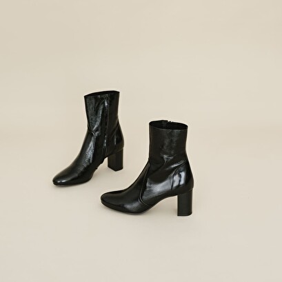 Heeled boots in black leather | didlaneo