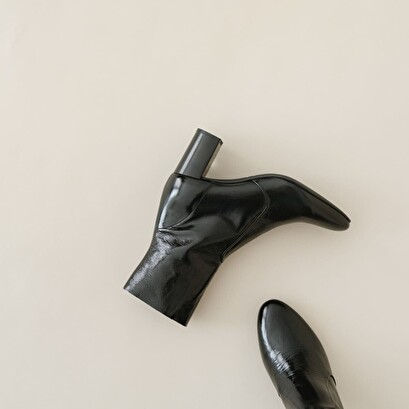 Heeled boots in black leather | didlaneo