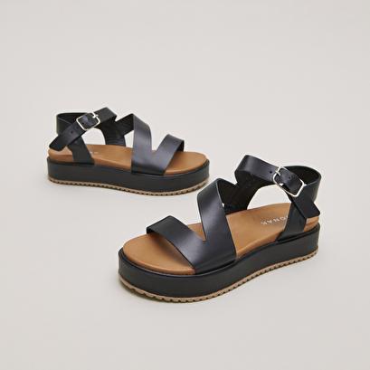 Platform sandals with straps in black leather | isaure