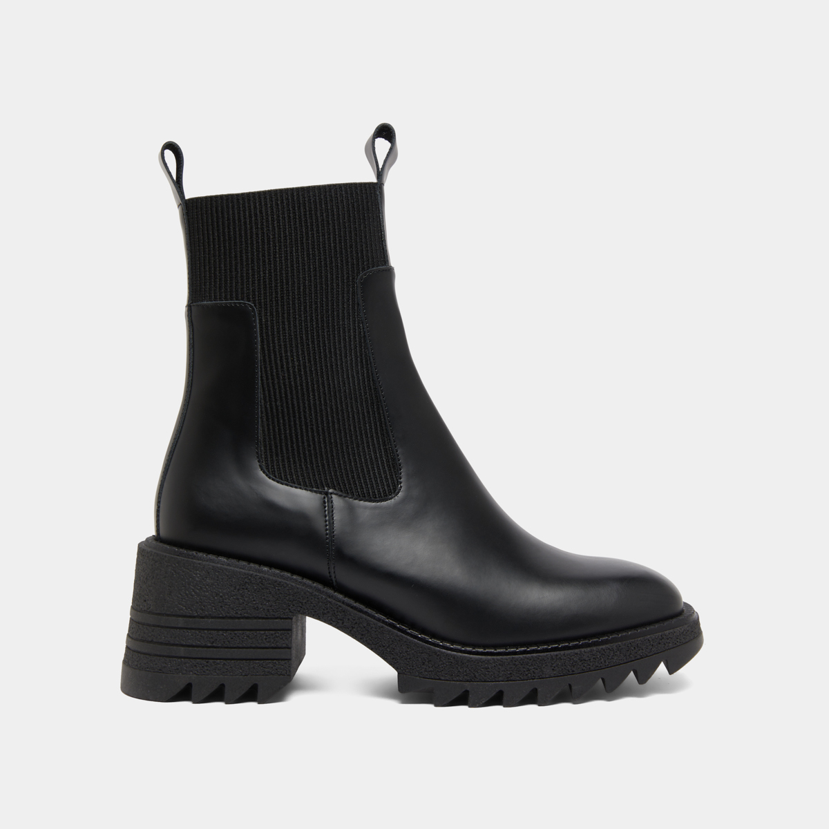 Boots with elastics and notched sole in glazed black leather | DOVE