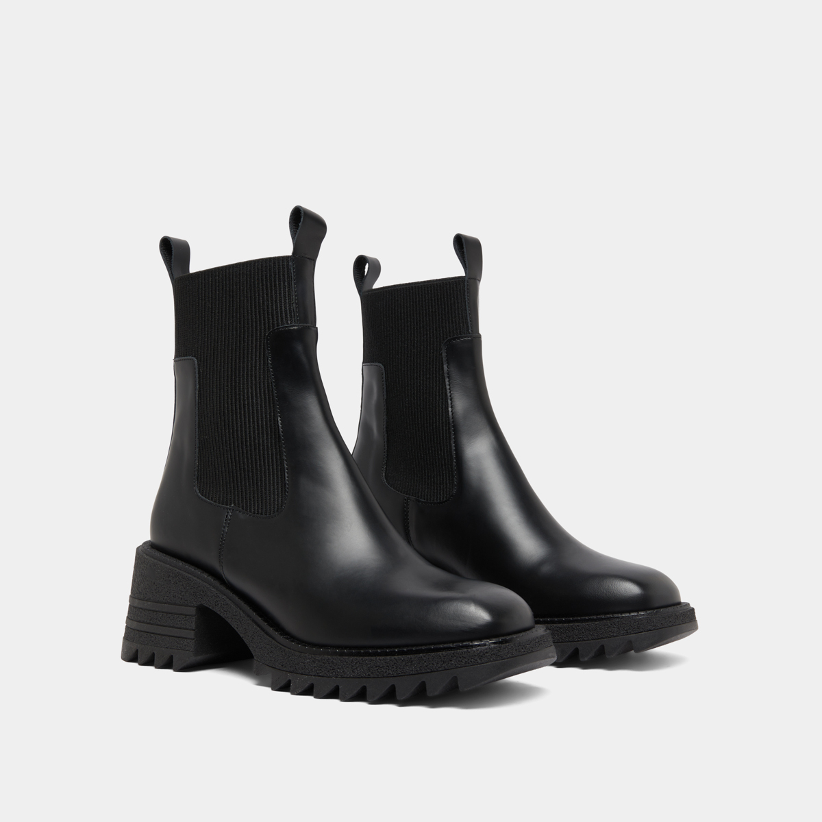 Boots with elastics and notched sole in glazed black leather | DOVE