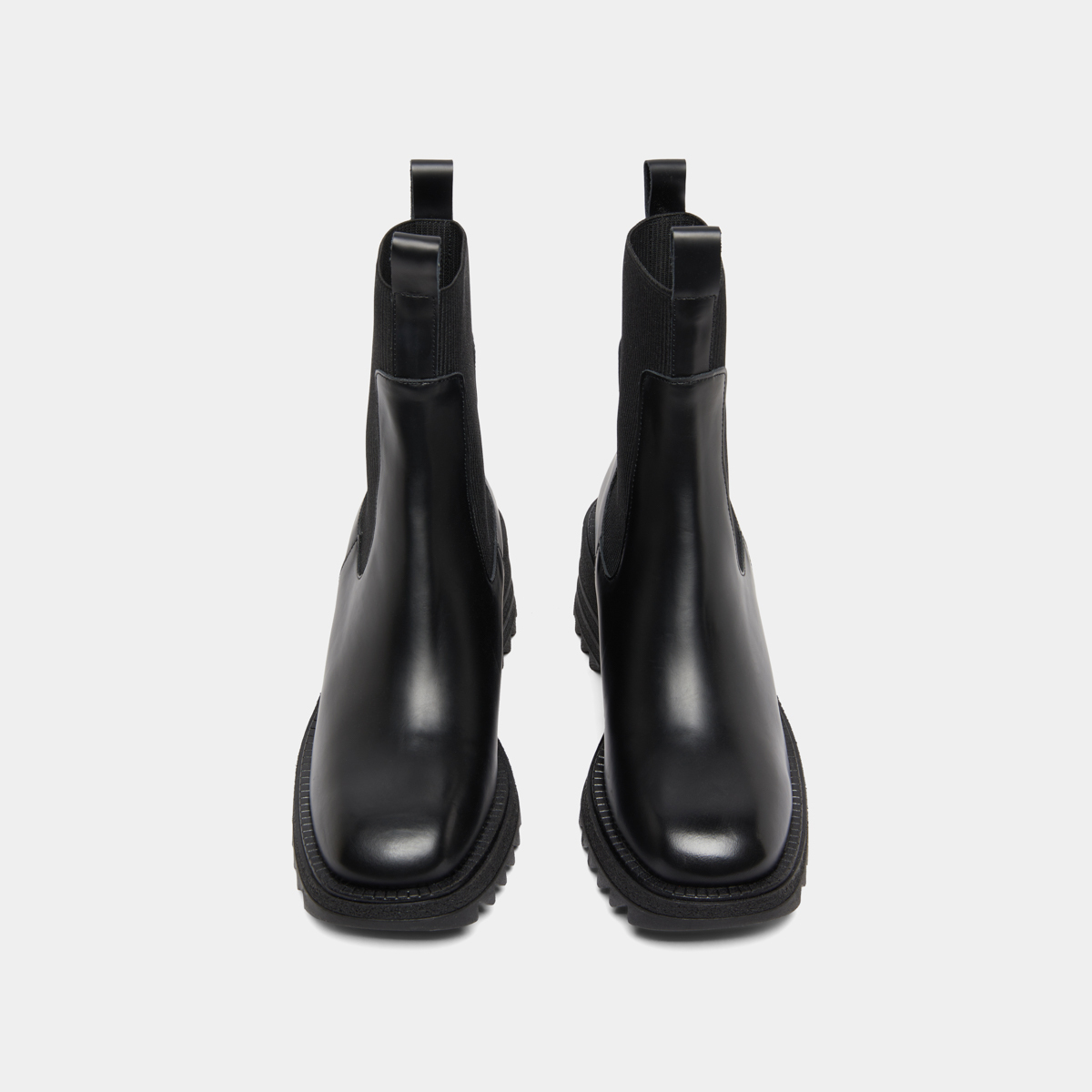Boots with elastics and notched sole in glazed black leather | DOVE