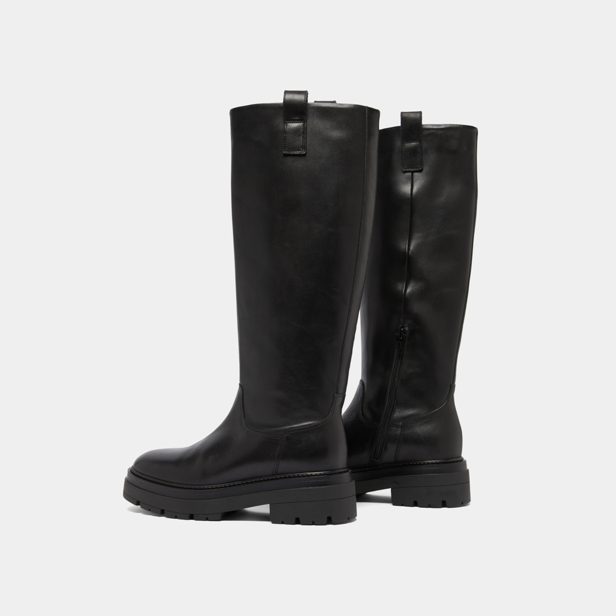 Boots with notched soles and square toe in black leather | PICUSSIA