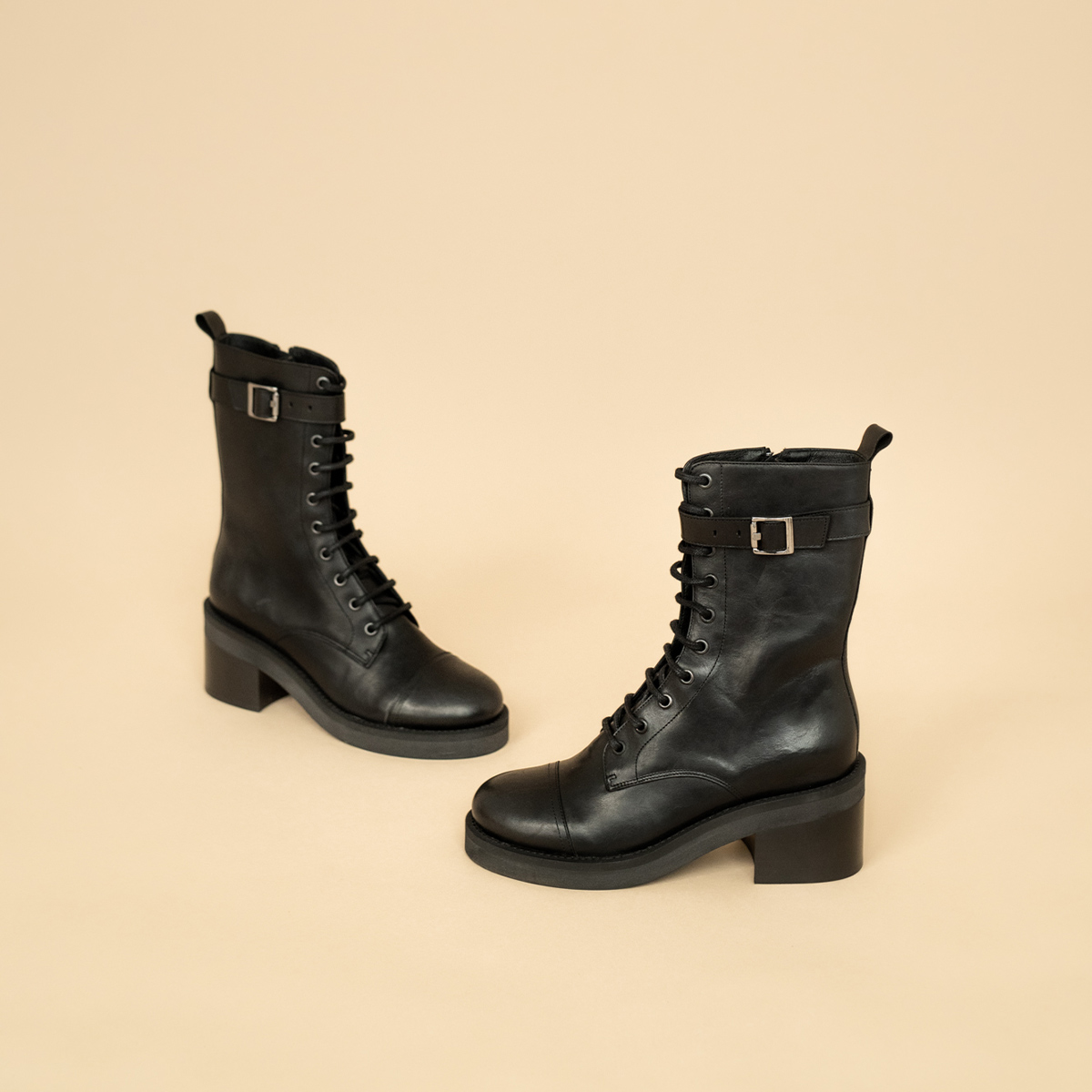 Lace-up ankle boots, heels and silver detail in black greased leather | ACONIT