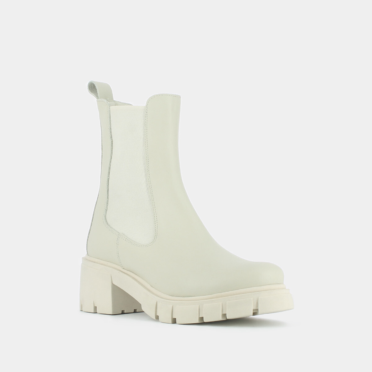Heeled boots with notched soles in ecru leather | MOISE