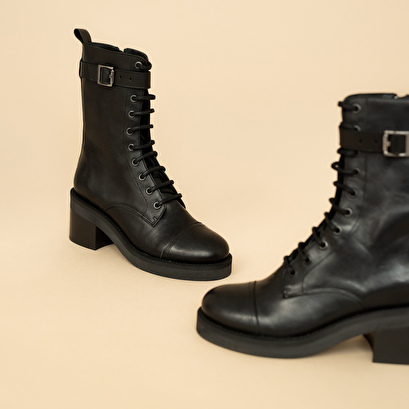 Lace-up ankle boots, heels and silver detail in black greased leather | aconit
