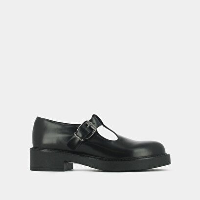 Thick-soled pumps in black shiny leather | didine