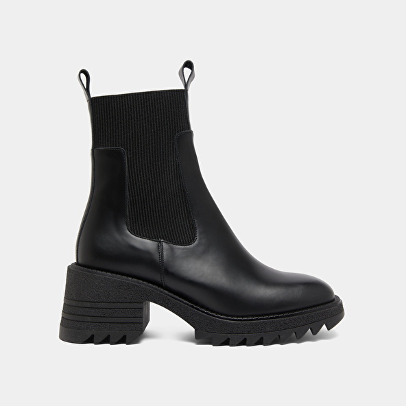 Boots with elastics and notched sole in glazed black leather | DOVE
