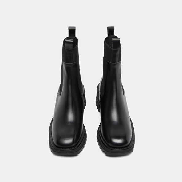 Boots with elastics and notched sole in glazed black leather | DOVE