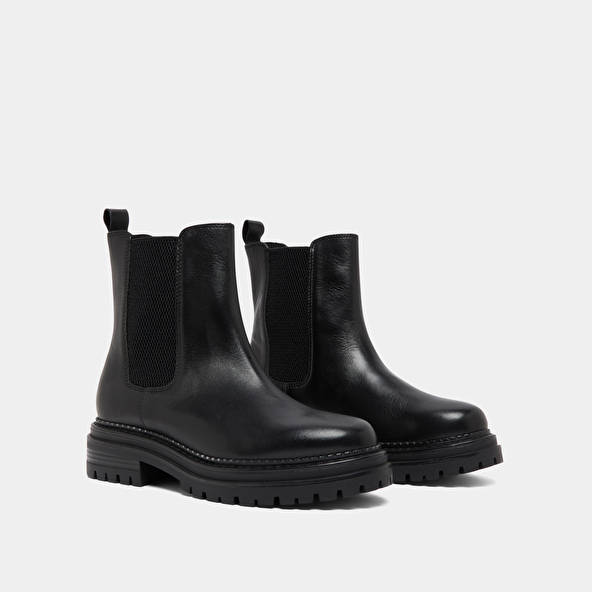 Low boots with notched soles and elastic in black leather | ADALARD