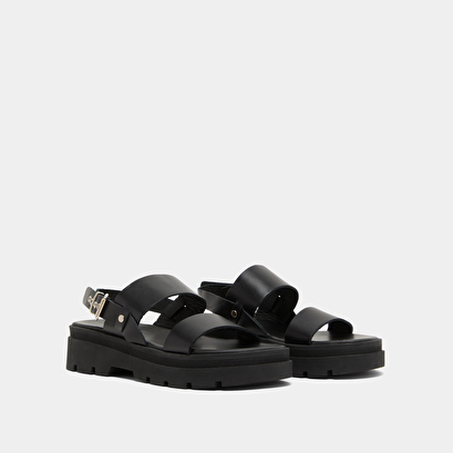 Sandals with thick straps and notched soles in black leather | PEINTURE