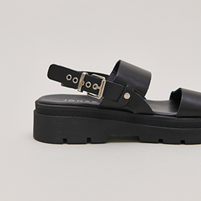 Sandals with thick straps and notched soles in black leather | PEINTURE