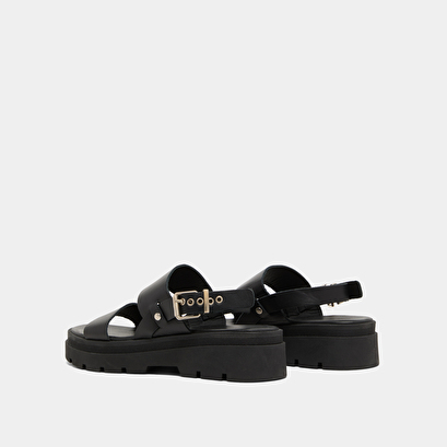 Sandals with thick straps and notched soles in black leather | PEINTURE