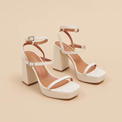 Strap and platform sandals in unbleached distressed leather | vlado