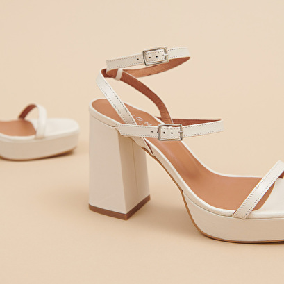 Strap and platform sandals in unbleached distressed leather | vlado