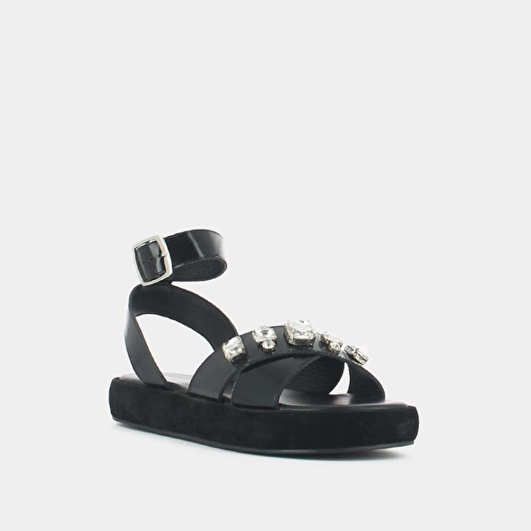 Cross-strap sandals with rhinestones in black glazed leather | WORLD