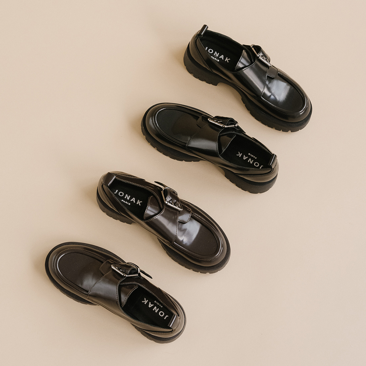 Derbies with flat heels, buckles and visible seams in black shiny leather | RAID