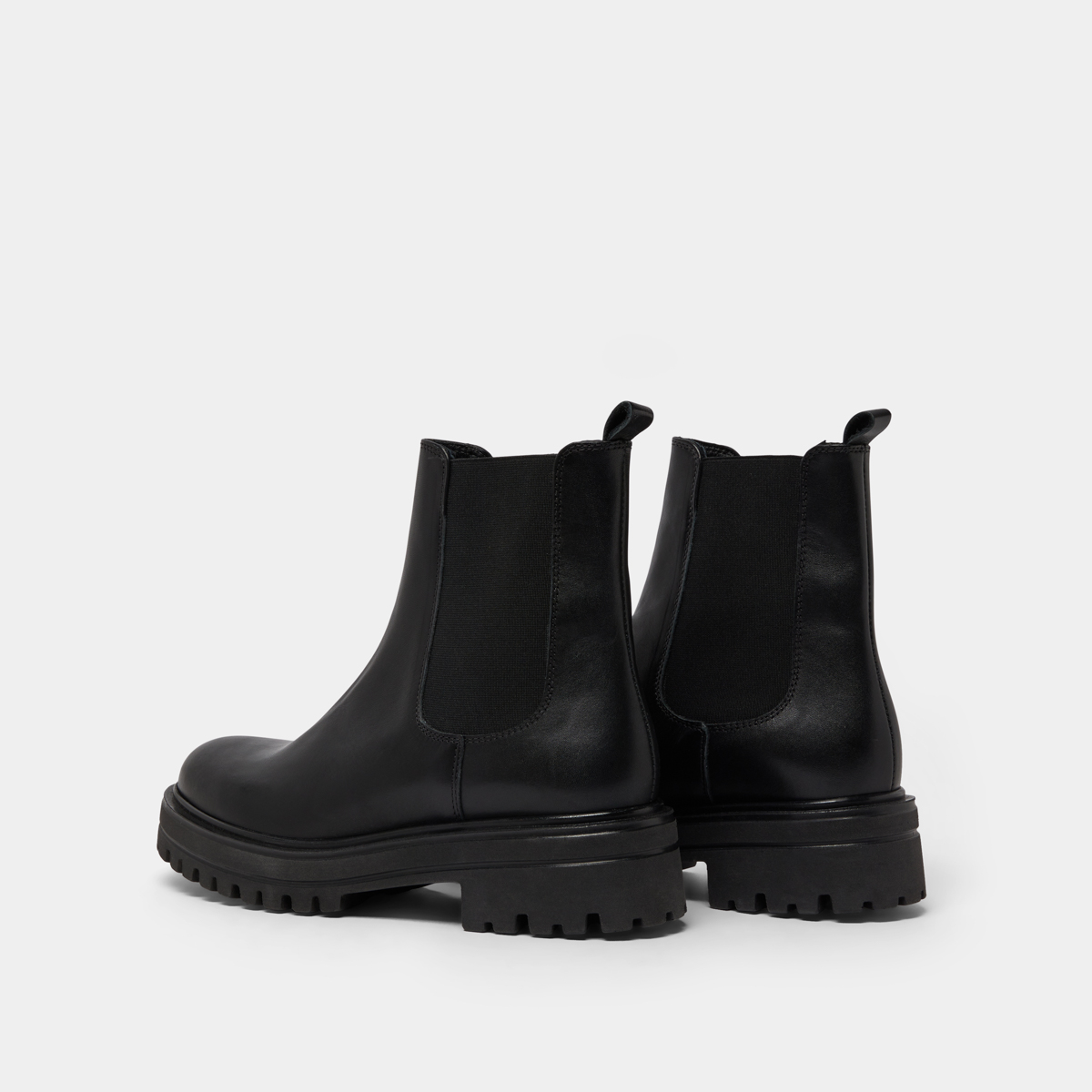 Boots with notched and elastic soles in black leather | AMANDINE