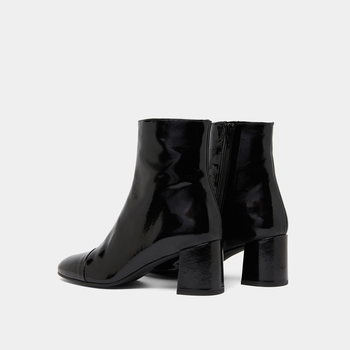 Heeled boots in black pleated patent | DONIAMA