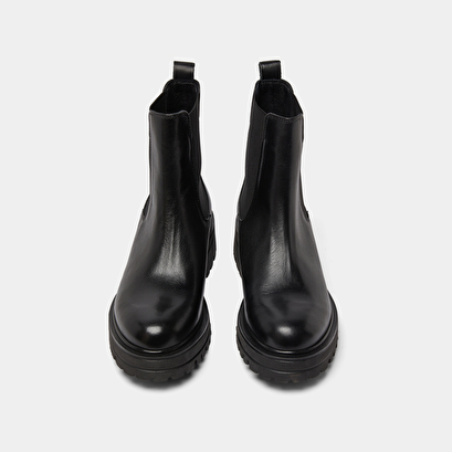 Boots with notched and elastic soles in black leather | amandine