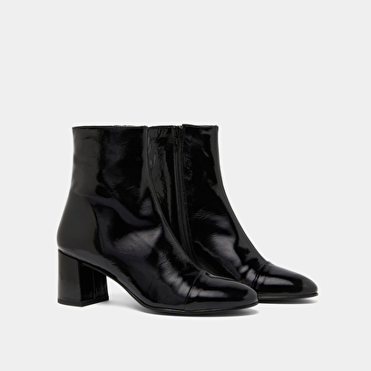 Heeled boots in black pleated patent | doniama