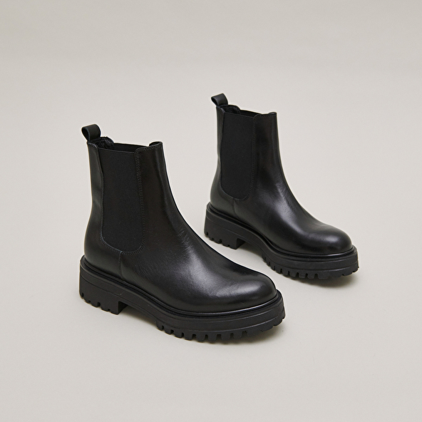 Boots with notched and elastic soles in black leather | AMANDINE