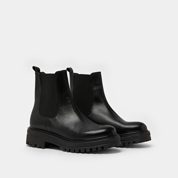 Boots with notched and elastic soles in black leather | AMANDINE