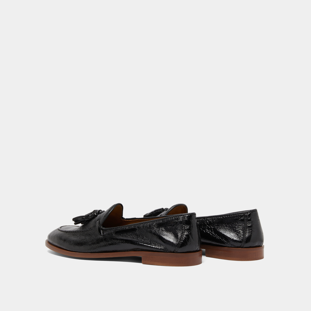 Round toe loafers with pompons in black pleated patent | TIPHAINE