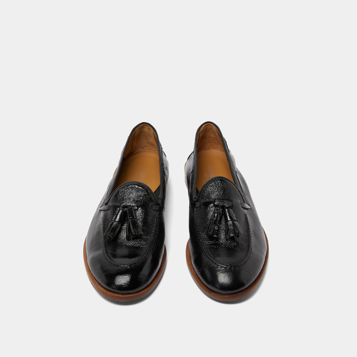 Round toe loafers with pompons in black pleated patent | TIPHAINE