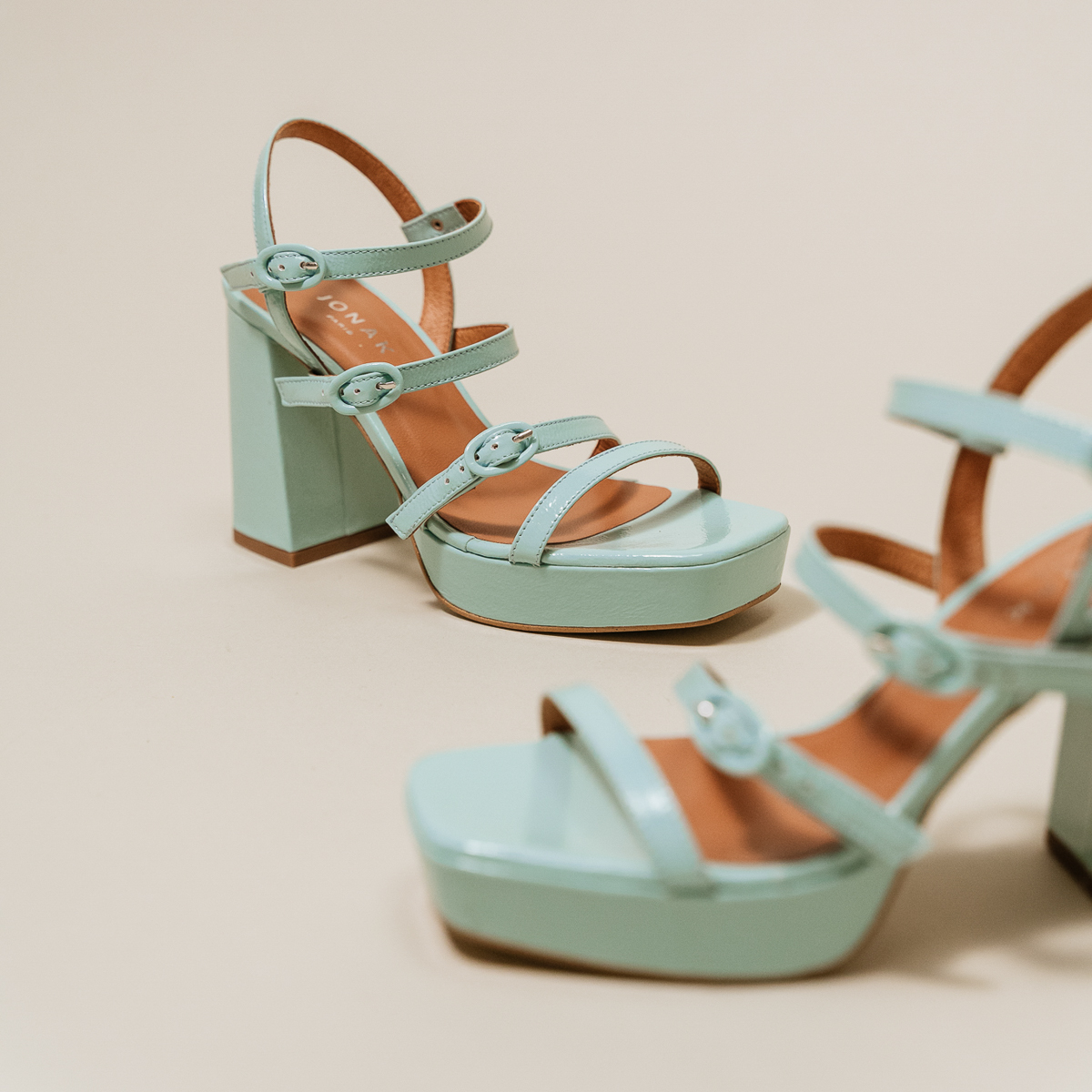 Sandals with straps and square toes in turquoise pleated leather | VALENS