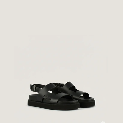 Cross-strap sandals in black shiny leather | lagune