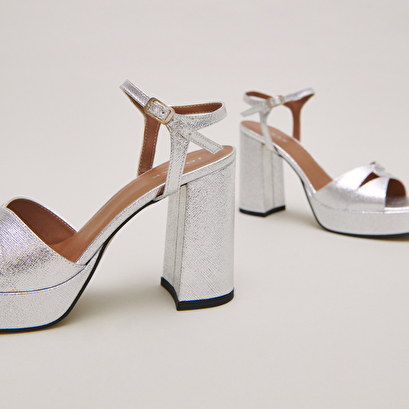 Platform sandals and high heels in silver metallic textile | JUSTINE