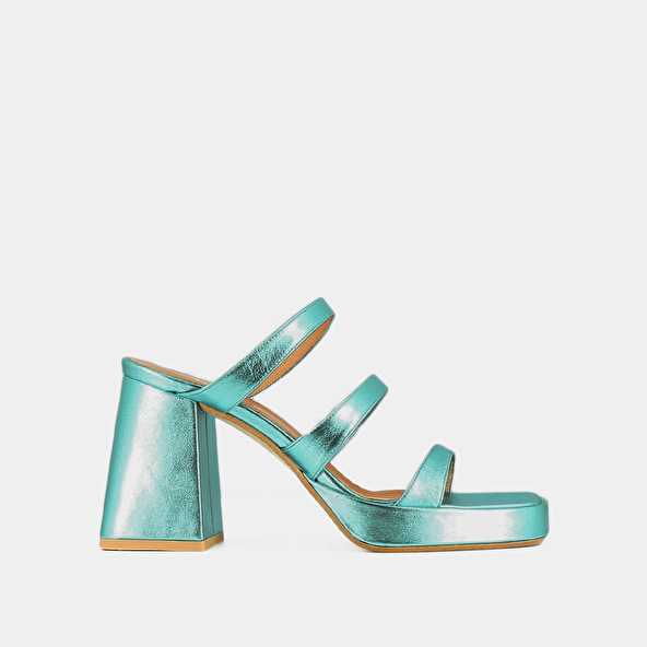Mules with straps and square toes in turquoise metallic leather | DONZELLE