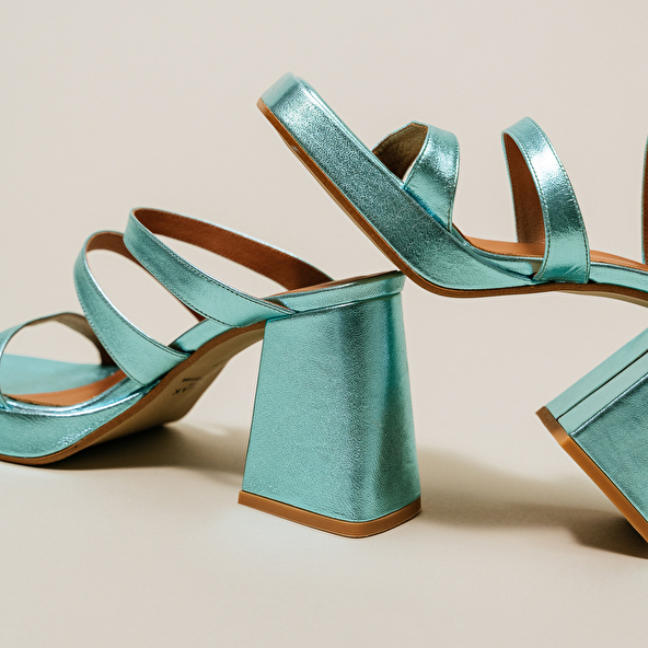 Mules with straps and square toes in turquoise metallic leather | DONZELLE