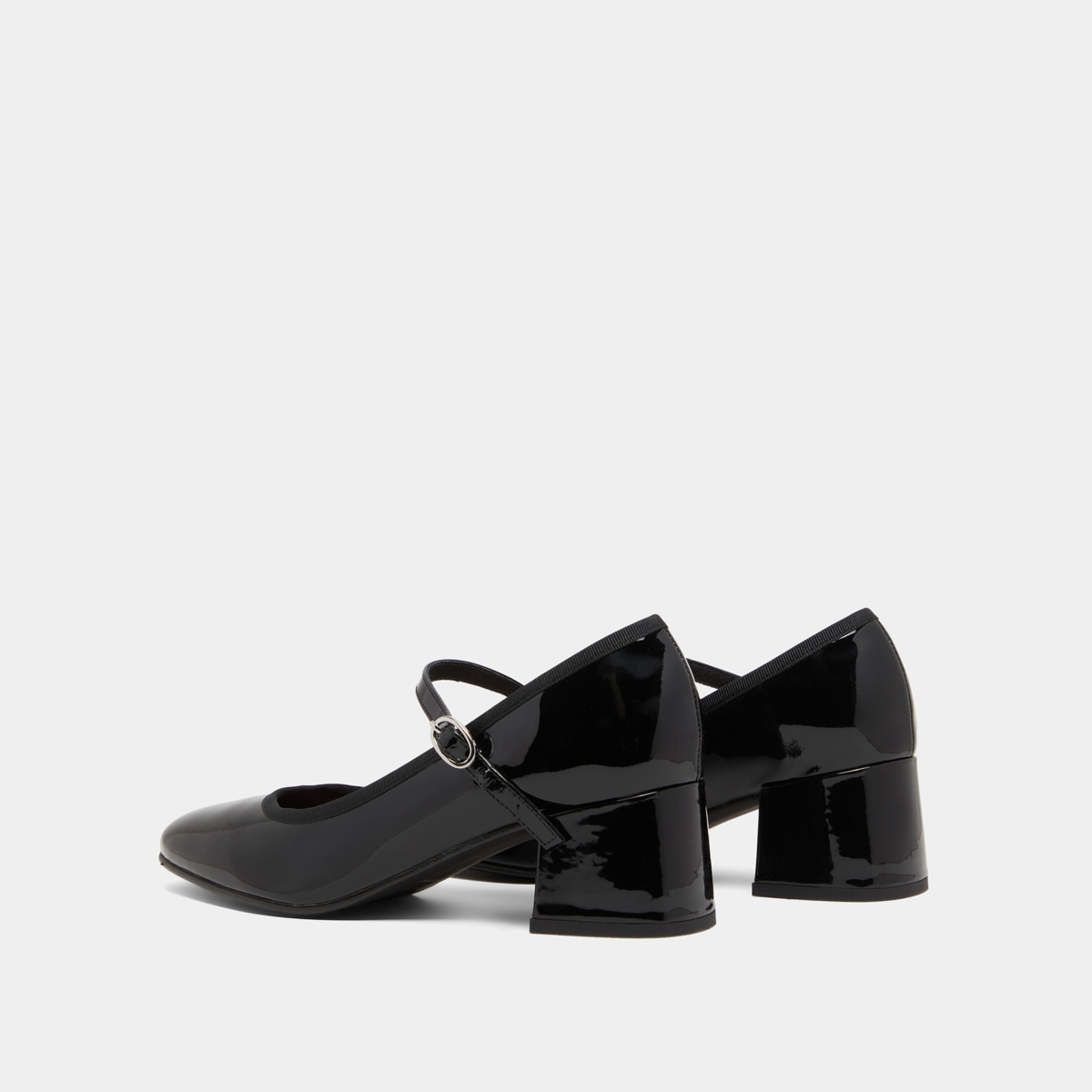 Heeled slippers in black patent leather | DALMATIE