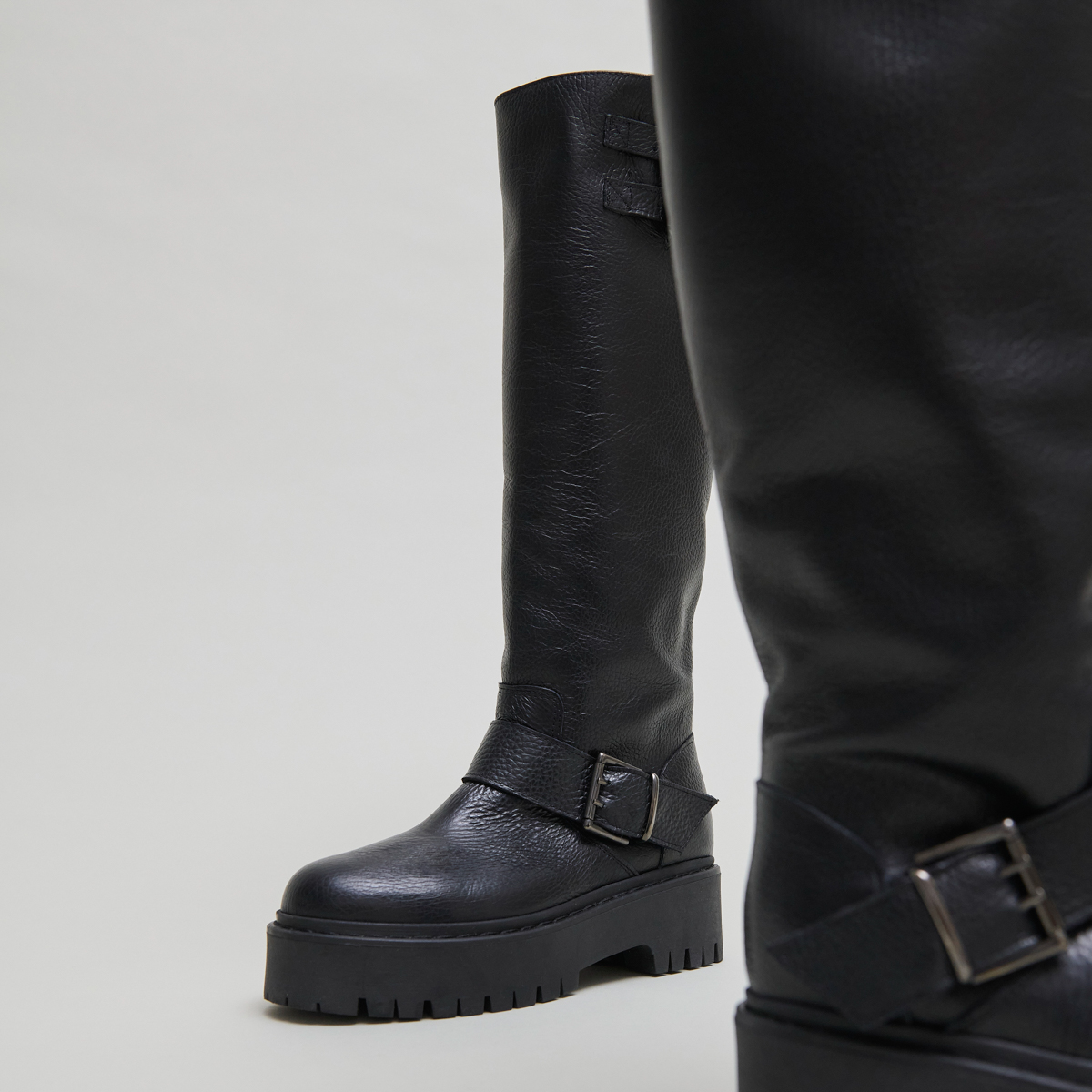 Chunky Strap Boots with Treaded Soles in black grained leather | REINE