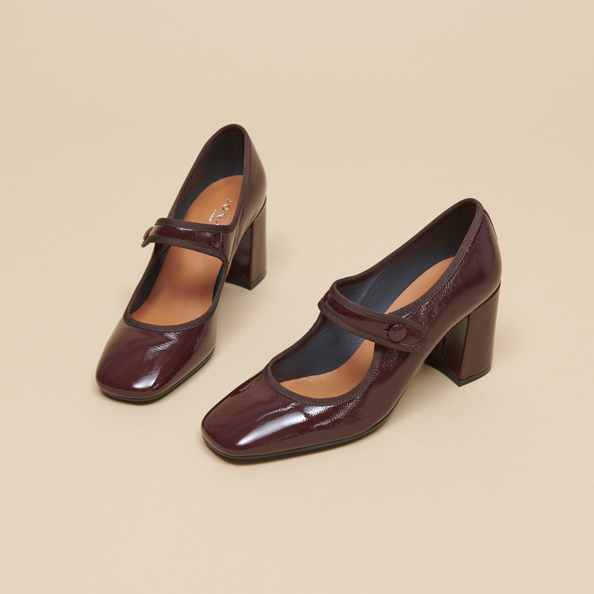 Heeled babies with big buckle straps in black pleated patent leather | DRANCY