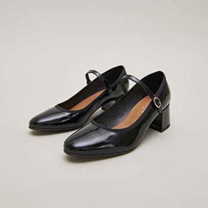 Heeled slippers in black patent leather | dalmatie