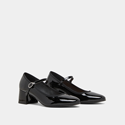 Heeled slippers in black patent leather | dalmatie