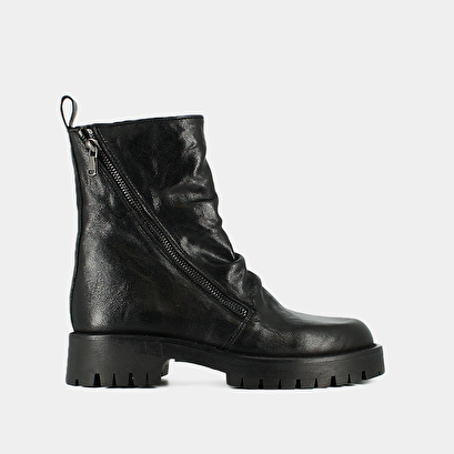 Boots with zips and notched soles in black aged leather | ROLIN