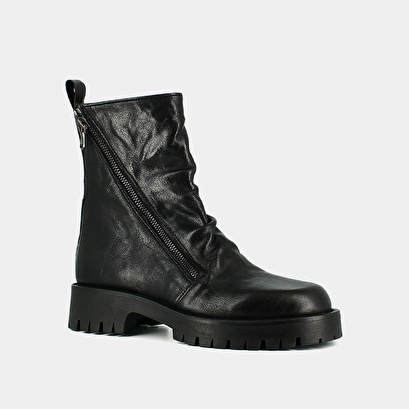 Boots with zips and notched soles in black aged leather | ROLIN