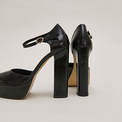 Heeled mary jane and platforms in black glazed leather | vancouver